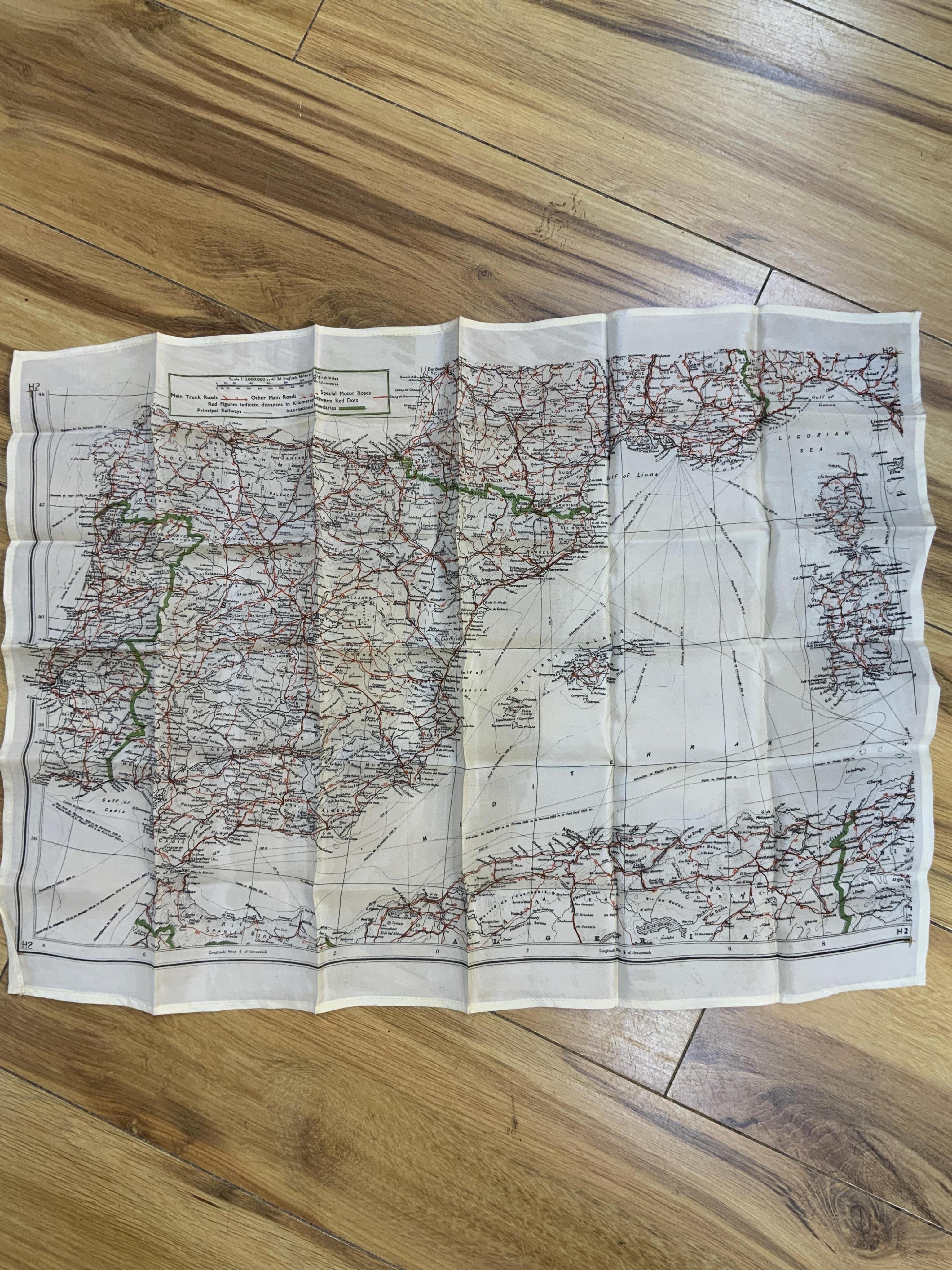 Four ‘escape’ style maps printed on silk type material, three printed double-sided; North Norway, 47x49cm, parts of Italy and Greece, 53x62cm, parts of France, 44x53cm, and a single sided map of part of the Mediterranean